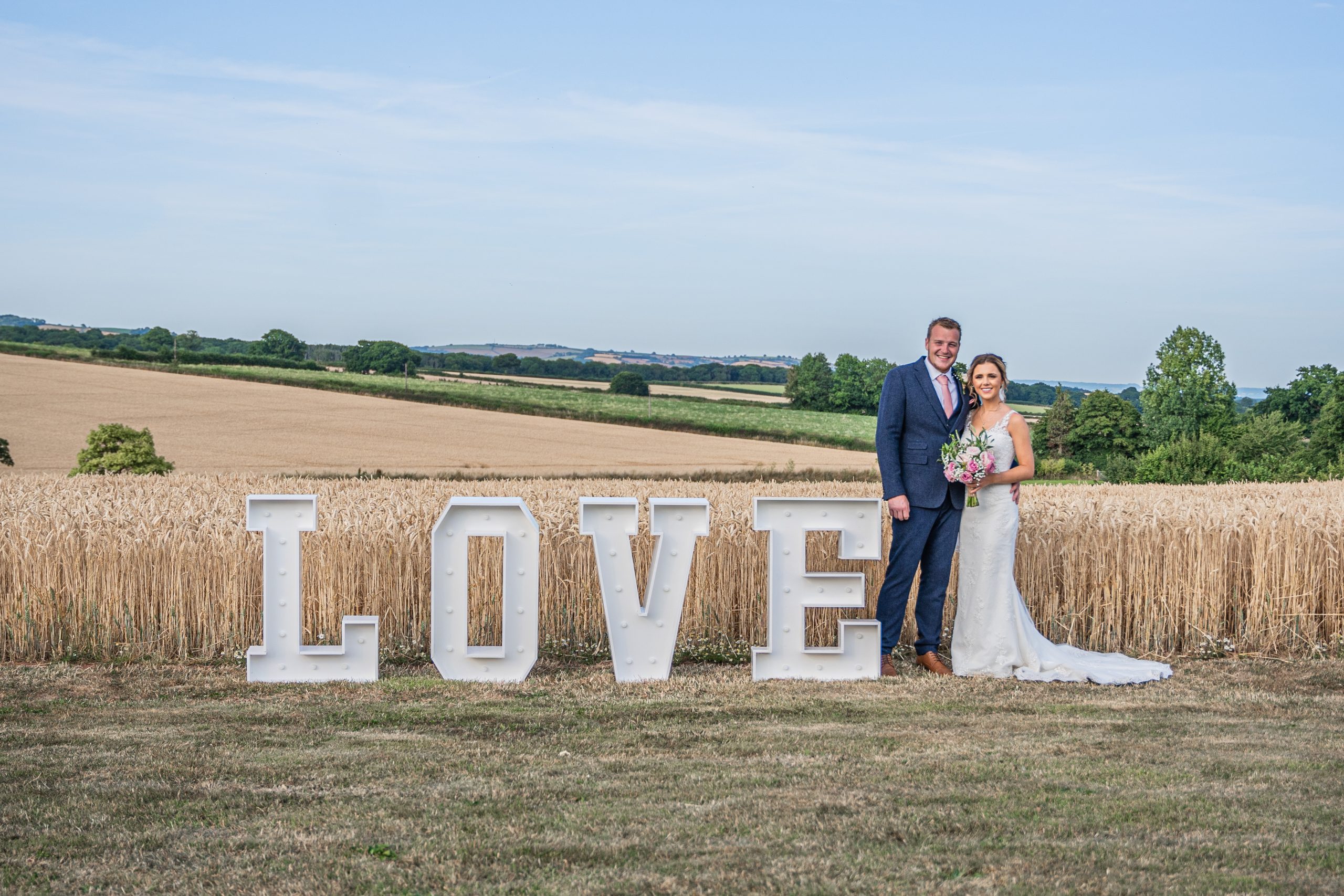 Harvest views with Ben and Becca standing by some giant love letters