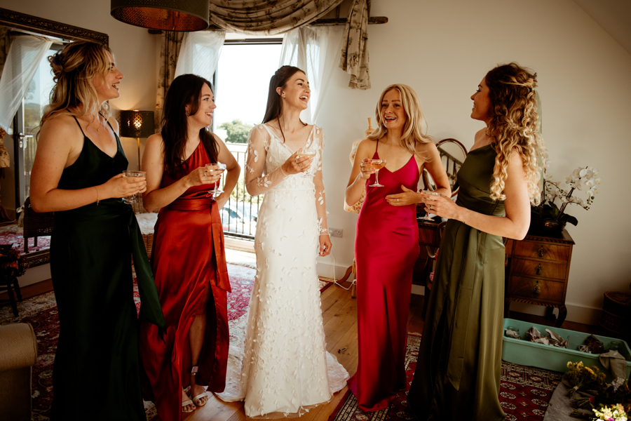 Fran and her bridesmaids in their jewel coloured dresses.