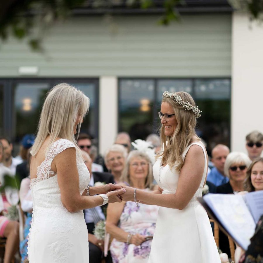 Two brides at an outside wedding ceremony in Devon