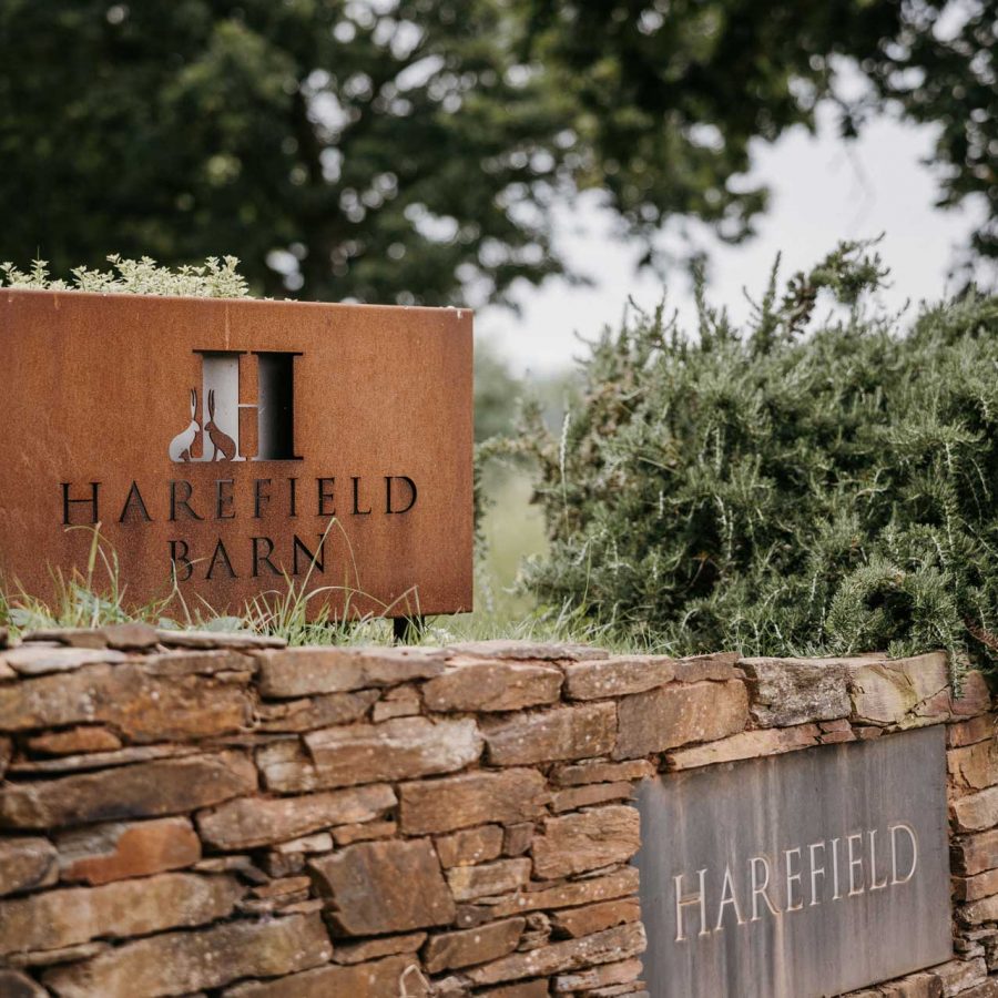 Entrance sign for Harefield Barn wedding venue Devon