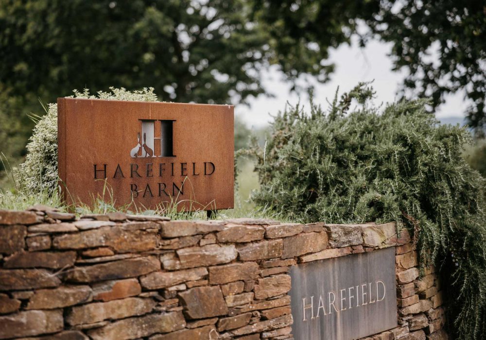Entrance sign for Harefield Barn wedding venue Devon